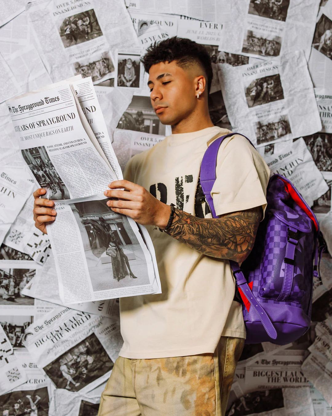 all systems go monte carlo spraygroung backpack with checker board pattern adn shark mouth design in purple 