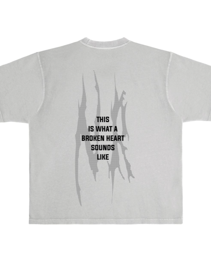 Gray t-shirt with black text and abstract design on a white background