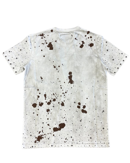 White t-shirt with brown splatter pattern on a white background