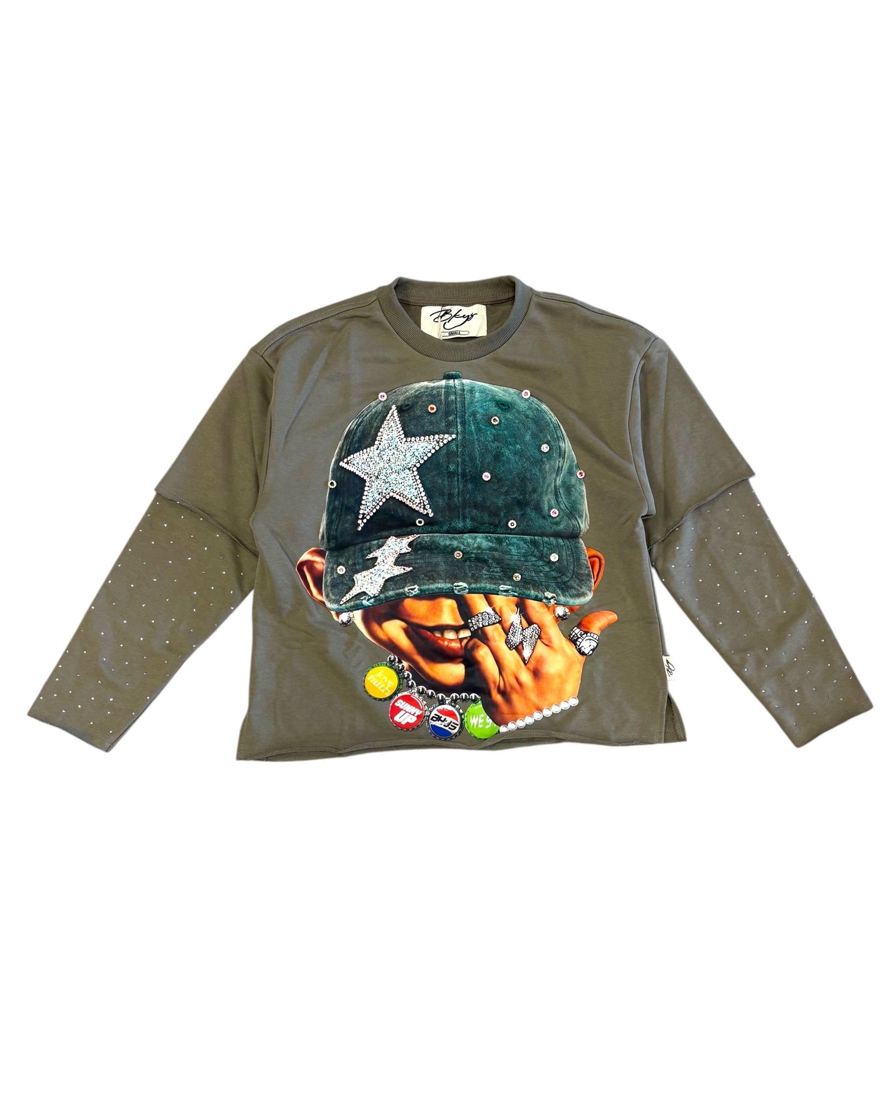 Green long-sleeve shirt with graphic design on a white background