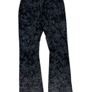 Black pants with a starry pattern on a white background