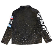 Black jacket with white speckles and branded sleeves on a white background
