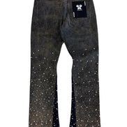 Black jeans with white speckles on a white background