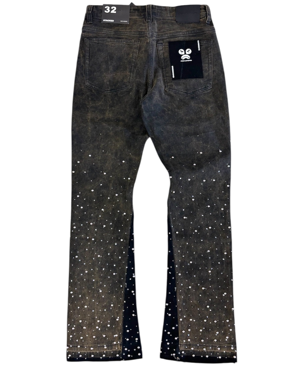Black jeans with white speckles on a white background