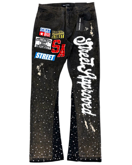 Black jeans with white text and graphics on a white background