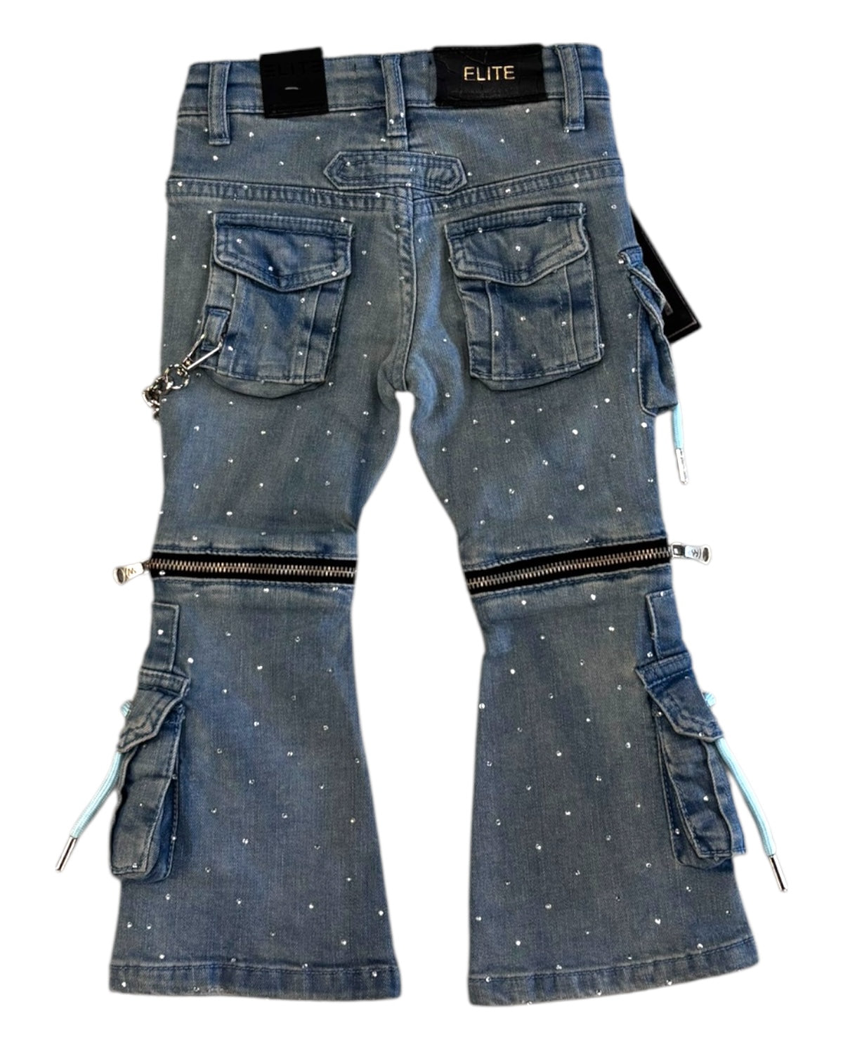 Blue denim pants with zippers, rhinestones, and patches on a white background