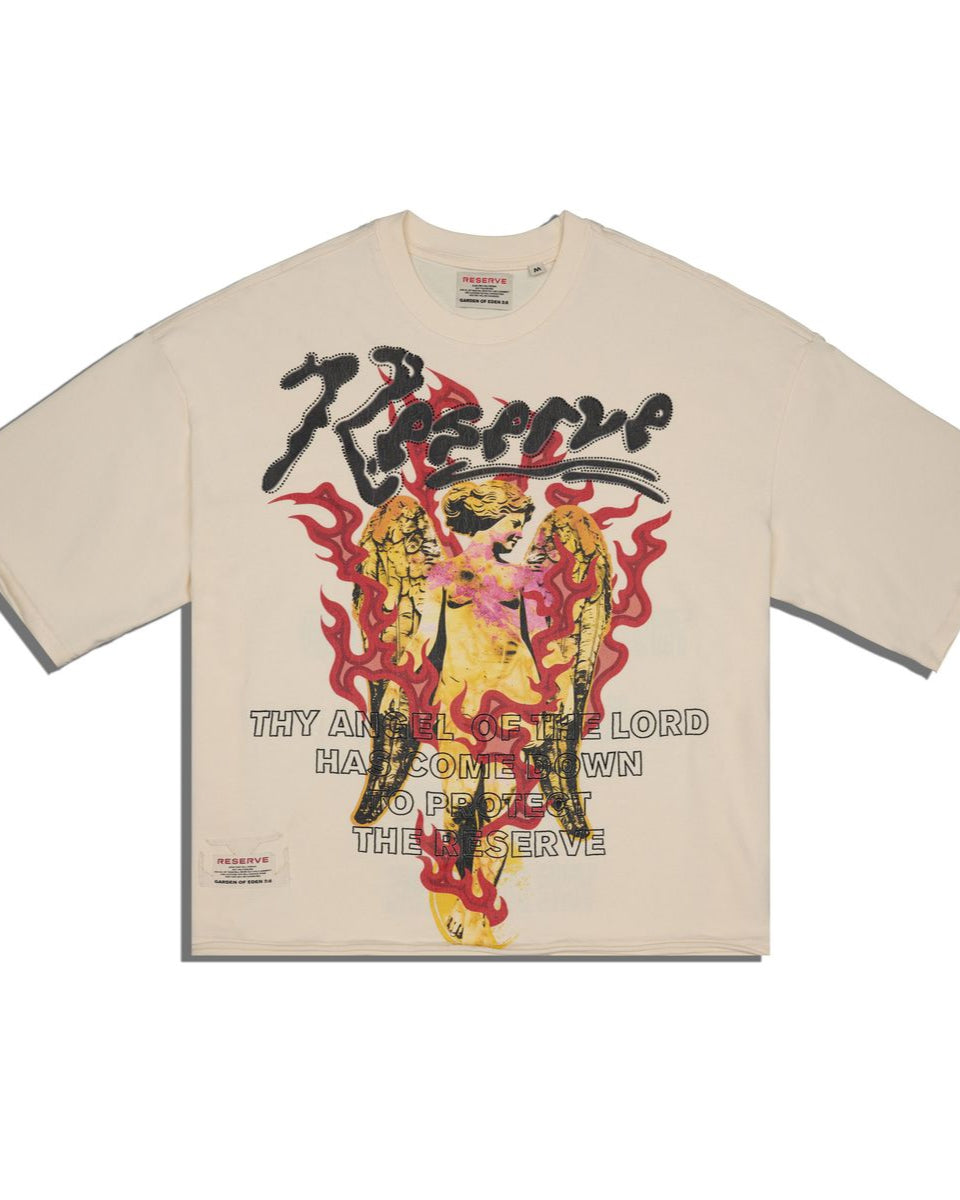 front of a bone color t-shirt with graphic design and text featured on a white background