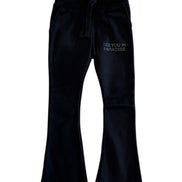 Black pants with 'SEE YOU IN PARADISE' text on a white background