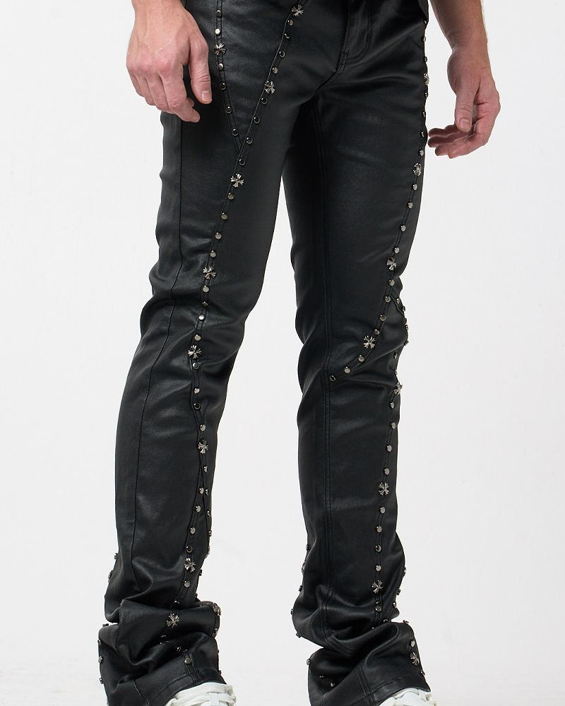 Black leather pants with studs on a white background