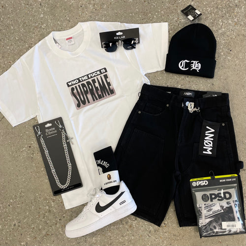 Supreme t-shirt, black pants, white sneakers, and various accessories on a concrete floor.