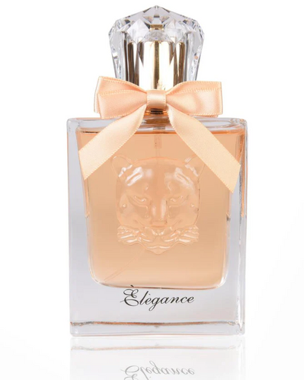 A clear glass perfume bottle with pale peach liquid, a faceted clear cap, a peach satin bow, and the word 'Elegance' printed near the bottom, shown on a white background.