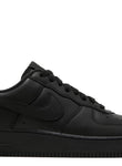 A pair of black Nike Air Force 1 Low sneakers with Supreme branding on the laces and heel tab.
